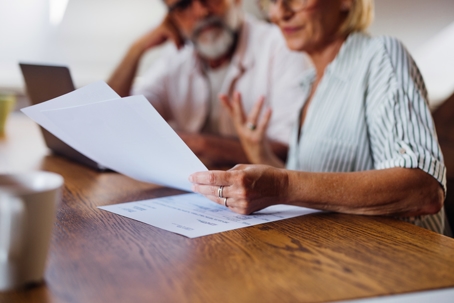 older couple reading documents